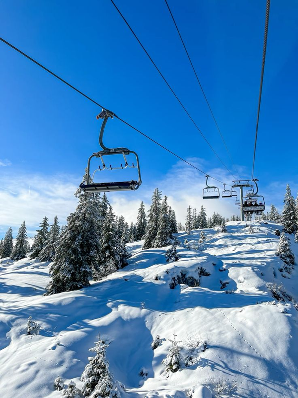 Ski lift above a snowy mountain